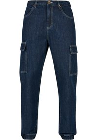 Mørkeblå denim cargo bukser med sidelommer, elastiske manchetter og kontrasterende hvide syninger. Standard talje med knaplukning.