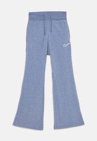 Rozšírené tepláky v jemnej modrej látke, s elastickým pásom na šnúrku a malým bielym logom Nike na ľavom stehne.