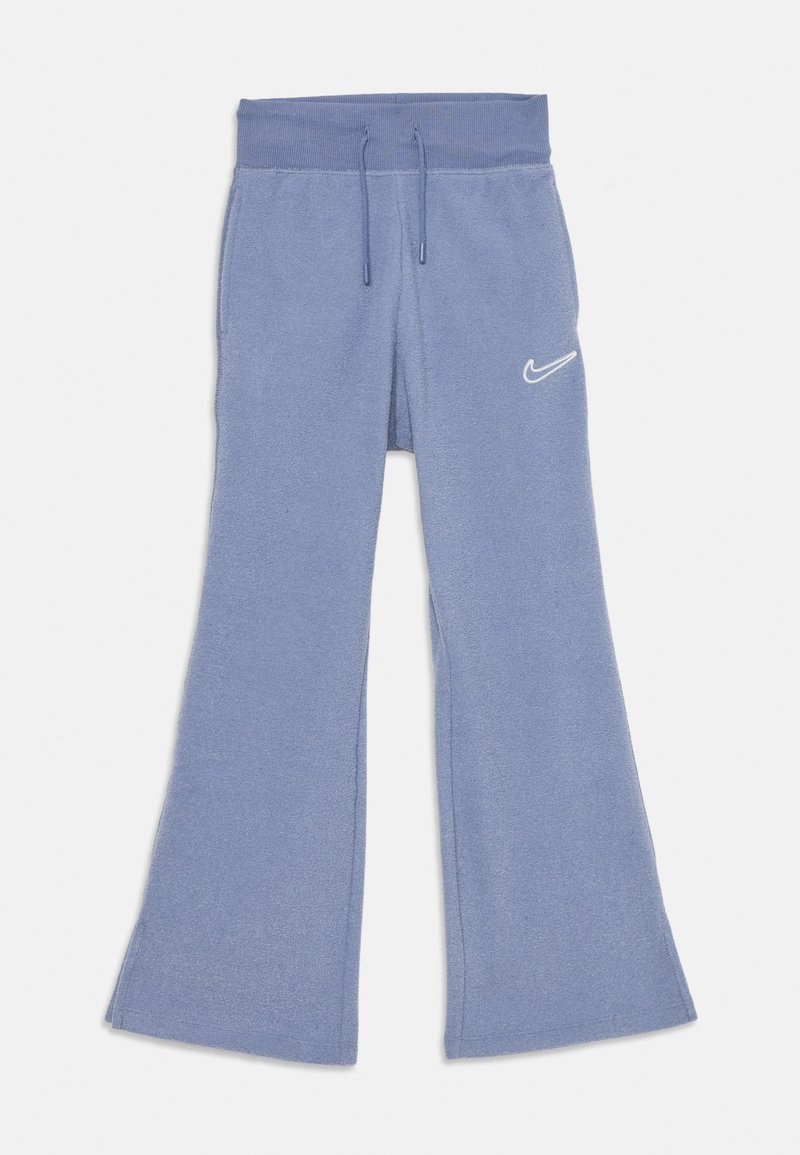 Rozšírené tepláky v jemnej modrej látke, s elastickým pásom na šnúrku a malým bielym logom Nike na ľavom stehne.
