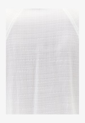 Valkoinen tekstuurinen kangas ruutukuvioinnilla, jossa on pehmeä, kevyt materiaali, joka sopii arkivaatteisiin. Lähikuva, joka tuo esiin kudontadetailit.