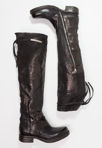 Black over-the-knee boots featuring a combination of matte and glossy textured leather, an adjustable lace, and a side zipper for closure.