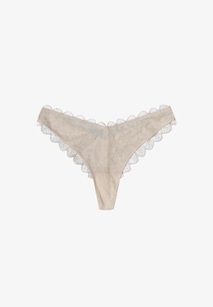 Beige Spitzenstring mit floralem Muster, gewellten Kanten und weicher Textur. Dünne Seiten und ein minimalistisches Design.