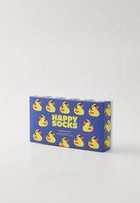 Blauwe kartonnen doos met gele rubberen eend graphics, "HAPPY SOCKS" logo, en tekst over volwassen crew sokken binnenin.