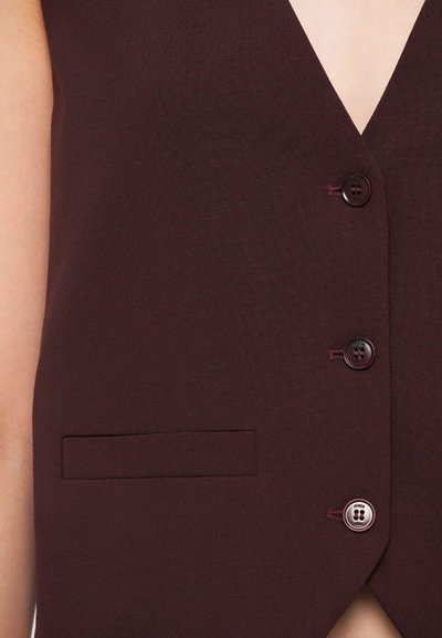 Burgundy vest with a deep V-neck, three buttons, and a side pocket. Made of smooth fabric with a clean, tailored design.