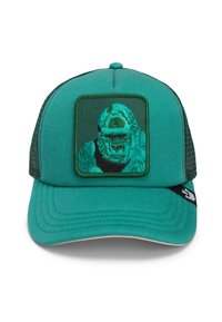 Green mesh-back cap with a solid front panel featuring a textured gorilla patch. The brim is flat with stitched detailing and logo accent.