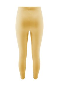 Żółte prążkowane legginsy o dopasowanym kroju, z wysokim stanem i gładką teksturą, sięgające do kostek.