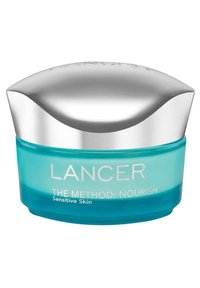 LANCER Die Methode: Nährcreme in einem runden, klaren türkisfarbenen Glas mit einem silbernen, reflektierenden Deckel, gekennzeichnet für empfindliche Haut.