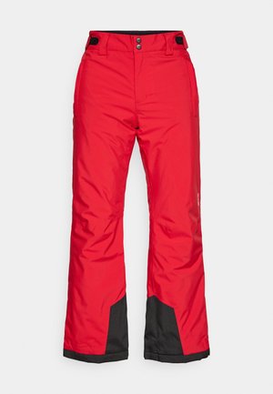Czerwone wodoodporne spodnie narciarskie z czarnym dolnym panelem, z regulowanym paskiem w talii i dwoma bocznymi kieszeniami; wykonane z gładkiego, trwałego materiału.