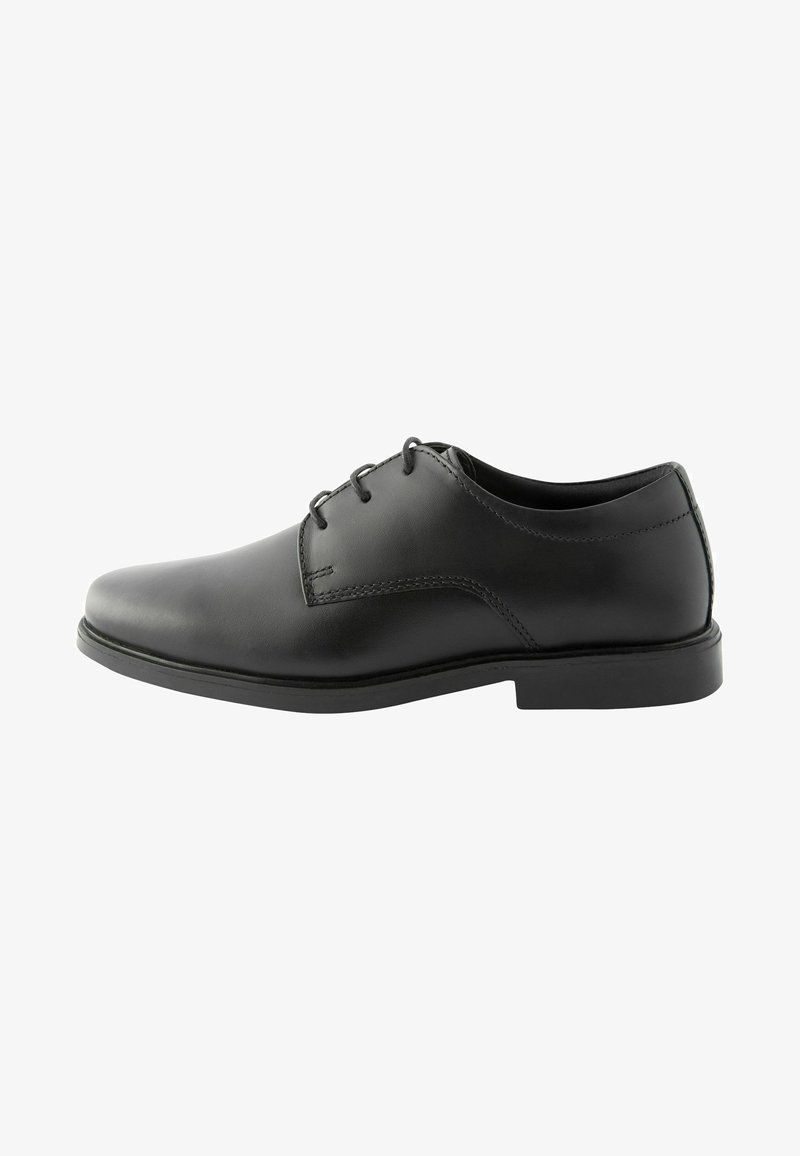 Black leather dress shoe with a rounded toe, plain vamp, six eyelets, and a low-profile rubber sole. Smooth texture with subtle stitching detail.