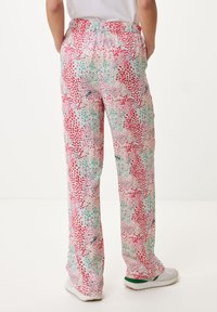 Spodnie w wielokolorowy wzór z mieszanką różowych, zielonych i białych kropek. Tkanina jest lekka, z elastycznym pasem i prostym krojem.