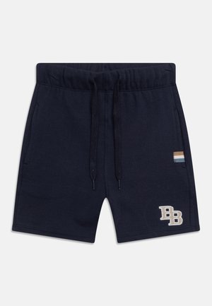 Shorts en coton bleu marine avec taille élastique et cordelette. Comprend des poches latérales et un logo brodé en beige. Accent rayé sur la poche.