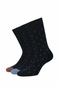 Trzy pary skarpet w ciemnych kolorach, z wzorem małych, wielokolorowych kropek. Materiał jest miękki, z ściągaczami i bezszwowym wykończeniem palców.