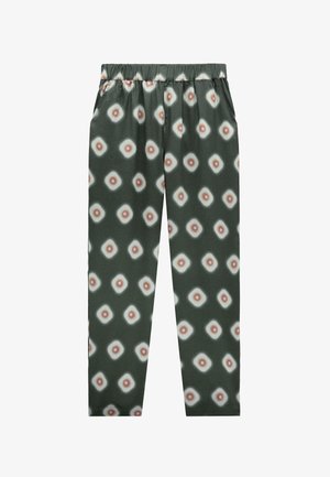 Zielone, zwężane spodnie z elastycznym pasem w talii, ozdobione powtarzającym się wzorem geometrycznym z białych i brązowych kół.