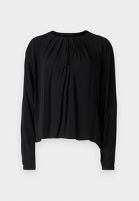 Blusa nera a maniche lunghe con collo rotondo, dettagli di plissettatura davanti e vestibilità rilassata. Tessuto liscio con una texture morbida.