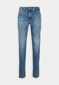 Blå denimjeans med slim fit och avsmalnande ben. Har fem fickor, knappstängning och en blekt tvätt med subtila slitningar.