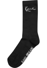 Schwarze Baumwollmischsocken mit geripptem Textur, mit weißem Karl Kani-Logo, das am Bund und Knöchel gestickt ist, zur Markenkennzeichnung.
