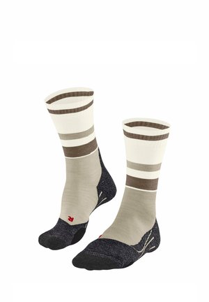 Paar knielange Socken mit beige-, braun- und cremefarbenen Streifen, verstärkten schwarzen Fersen und Zehen sowie einer roten "R"-Markierung an einem Socke.