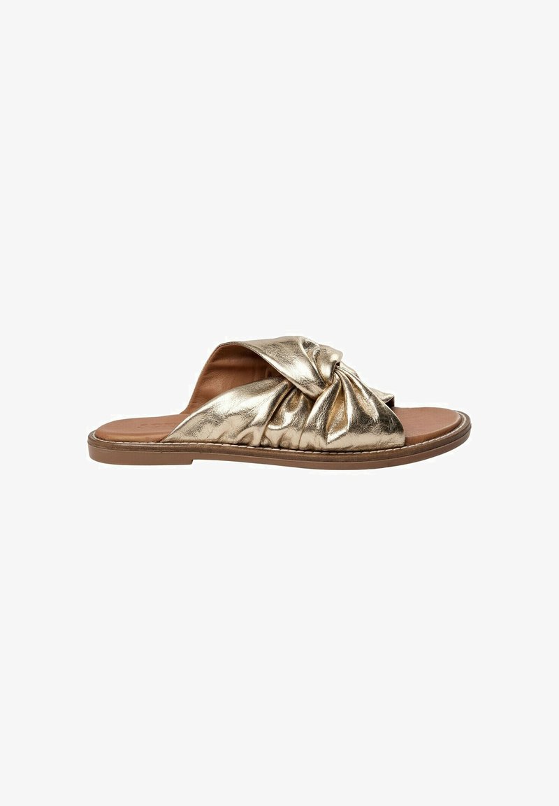 Gold metallic slide sandal with a knotted front design, soft fabric texture, open toe, and a flat brown sole.