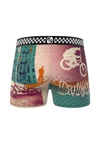 Boxer shorts sur le thème du vélo avec une ceinture à carreaux, présentant un design coloré de bâtiments et de silhouettes de vélos. Matière en coton.