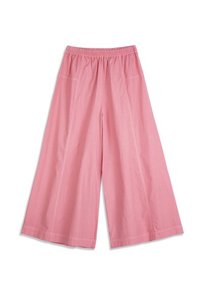 Pantalon ample rose avec taille élastique et poches latérales, présenté à plat sur un fond blanc.