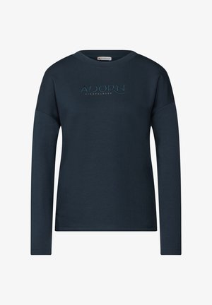 Maglietta a maniche lunghe blu navy in cotone, con ricamo frontale con le parole "ADORN" e "MINDFULNESS" in colori a contrasto. Vestibilità semplice e rilassata.