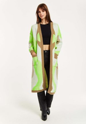 Long cardigan with a green and beige abstract pattern, made of textured knit fabric. Features open front, two front pockets, and ribbed cuffs.
