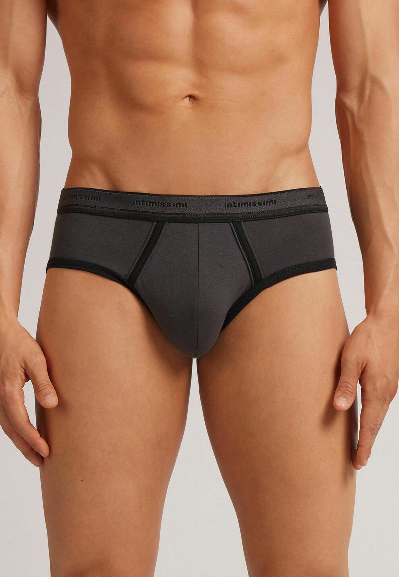 Grijze katoenen boxershort met een zwarte tailleband met het "intimissimi" logo. Het ontwerp bevat contrasterende zwarte accenten en heeft een aansluitende pasvorm.