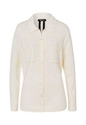 Cream-colored cardigan made of soft fabric, featuring a collared neckline, button closure, and two chest pockets.