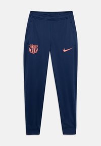 Jūras spēku treniņbikses, kas izgatavotas no viegla auduma, ar rozā Nike logo un FC Barcelona emblēmu uz kreisā augšstilba, ar sānu kabatām un elastīgu jostu.