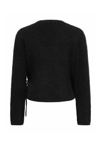 Pull noir à manches longues en tissu duveteux, avec un col rond et un détail noué sur le côté, vu de dos.
