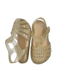 Sandalias de gel doradas con purpurina, con punta cerrada, correa ajustable y tiras verticales para ventilación. Superficie interior suave.