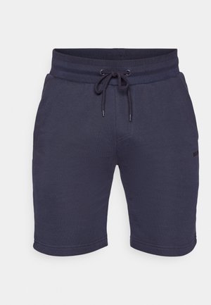 Navy blue shorts made of soft fabric, featuring an elastic waistband with drawstring, side pockets, and a subtle logo detail on the leg.