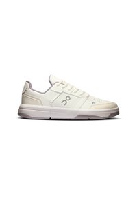 White athletic sneakers with a smooth leather and mesh upper, featuring textured accents and a grey logo on the side. Low-profile, lace-up design.