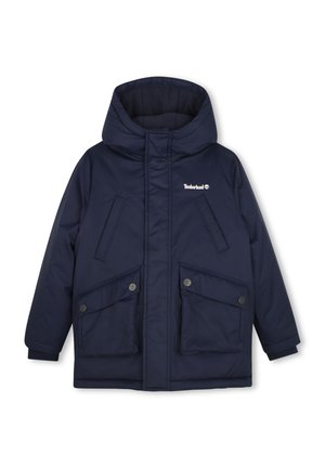 Veste d'hiver bleu foncé à capuche avec fermeture éclair devant, quatre poches et logo Timberland sur la poitrine.