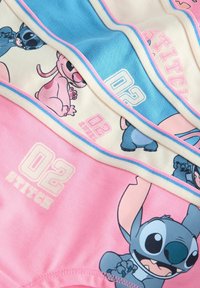 Värikäs sarjakuvateemainen alusvaatesetti, jossa on Stitch- ja Angel-hahmot, vaaleanpunaisissa, sinisissä ja kermansävyissä sekä näkyvissä graafisilla kuvioilla.