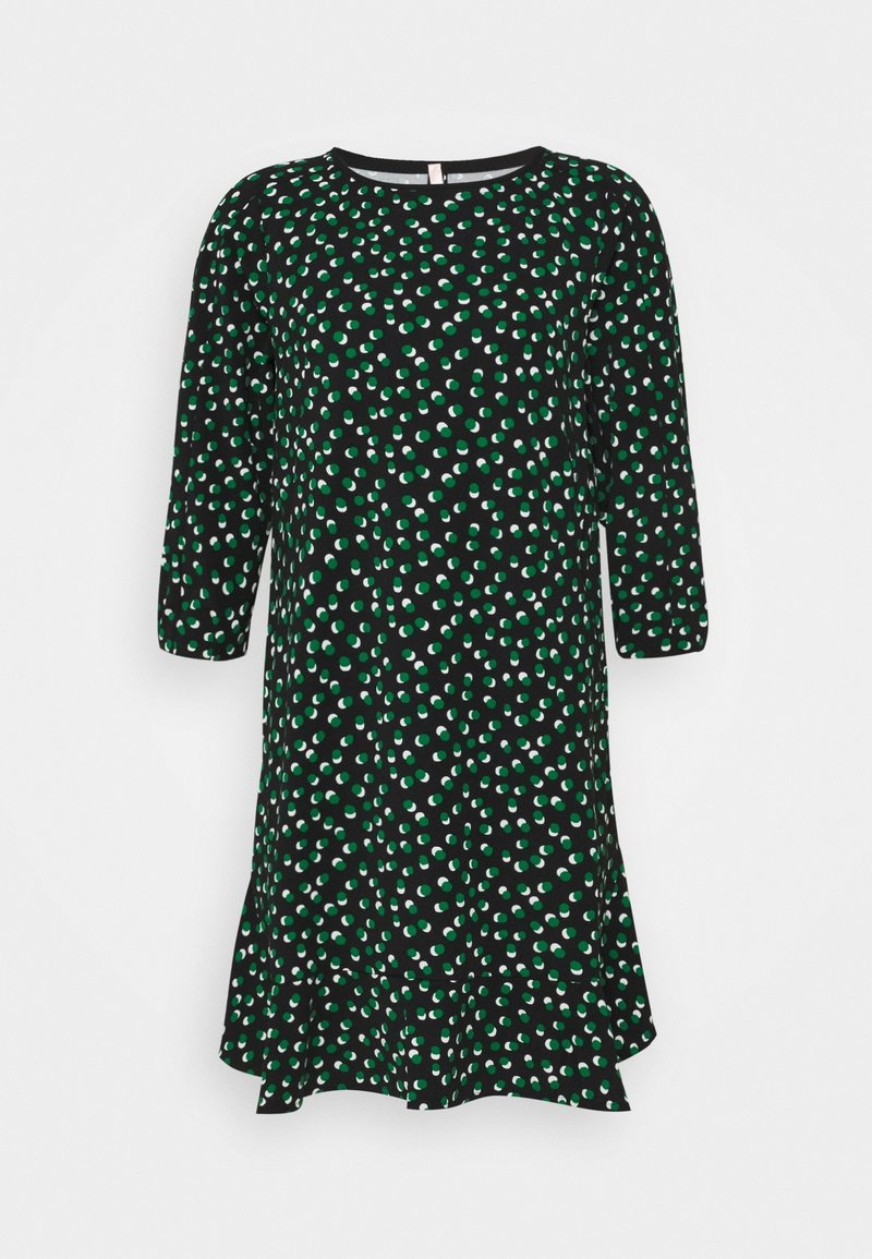 Robe noire à manches longues avec motif à points verts et blancs irréguliers et ourlet à volants.