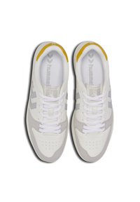 White sneakers with gray accents, a suede toe cap, and a yellow heel tab. Features classic lacing and perforations for ventilation.