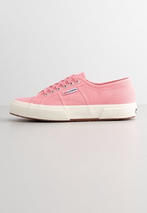 Low-top pink canvas sneaker with white rubber sole, lace-up front, and small "Superga" logo on the side.