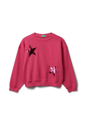 Felpa rosa a collo rotondo con maniche lunghe, caratterizzata da due grandi toppe di paillettes a forma di stella lucente sul davanti.