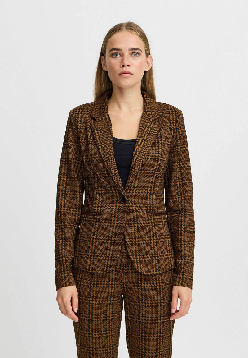 Brown checkered blazer with a fitted design, notched lapels, single-button closure, and long sleeves, paired with matching checkered trousers.
