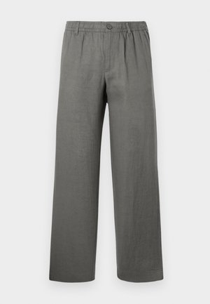 Harmaat pellavahousut, joissa on rento malli, joustava vyötärö, nappisulku ja suorat lahkeet. Tasainen kangas, minimalistinen muotoilu.