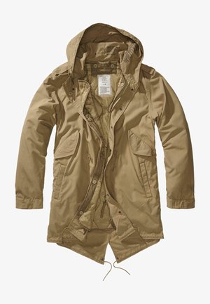 Šviesiai ruda lengva parka su kapsule, turinti priekinės užtrauktuko kišenes, užtrauktuko uždarymą, reguliuojamą apačią ir minkštą vidinį pamušalą.