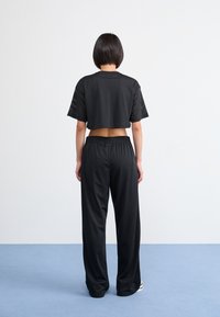 Nike Sportswear PANT COORD - Donji dijelovi trenirke - black