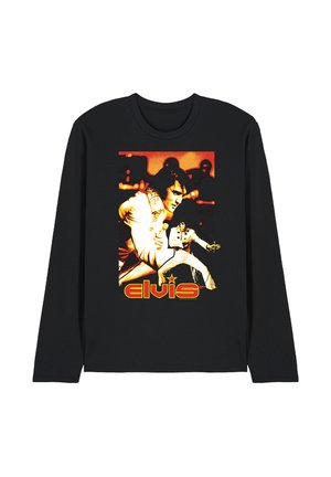 Black long-sleeve shirt with graphic of Elvis Presley in white jumpsuit singing and dancing, with "elvis" text in red and yellow below.