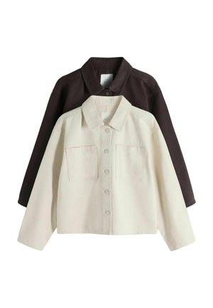 Két gombos, galléros dzseki, az egyik crème színű elöl, a másik sötétbarna hátul, mindkettőn mellzseb található.