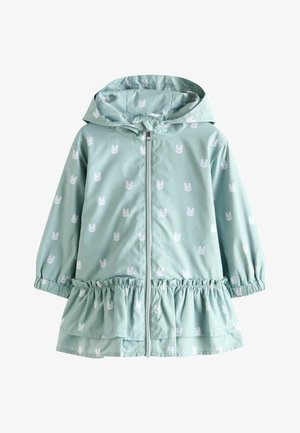 Imperméable vert menthe avec motif de lapins blancs, ourlet à volants élastiqué, fermeture éclair devant et capuche. Fabriqué en matériau léger.