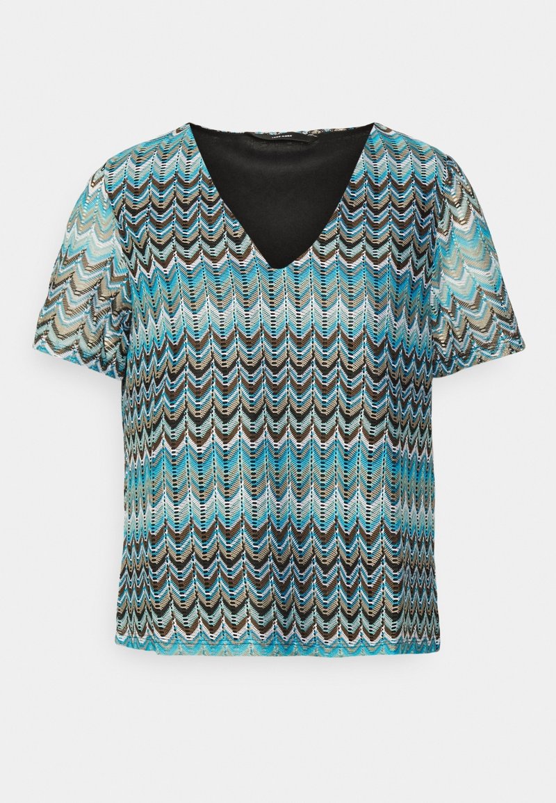 Haut à manches courtes col en V avec motif chevron zigzag bleu, noir, blanc et marron et doublure intérieure noire sur fond blanc.