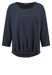 Blouse manches longues bleu marine avec col rond et ourlet froncé, taille petite, design uni avec une texture subtile du tissu.
