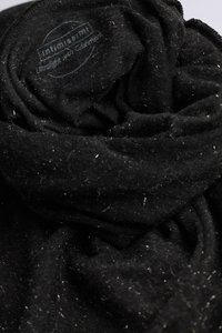 Black, lightweight cotton scarf with a textured, soft finish. The fabric is slightly wrinkled, revealing lint and fuzz details.