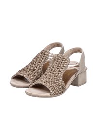 Sandales ouvertes beiges avec un dessus en tissu tissé, une sangle à l'arrière et un petit talon épais. La semelle présente un motif de traction léger.